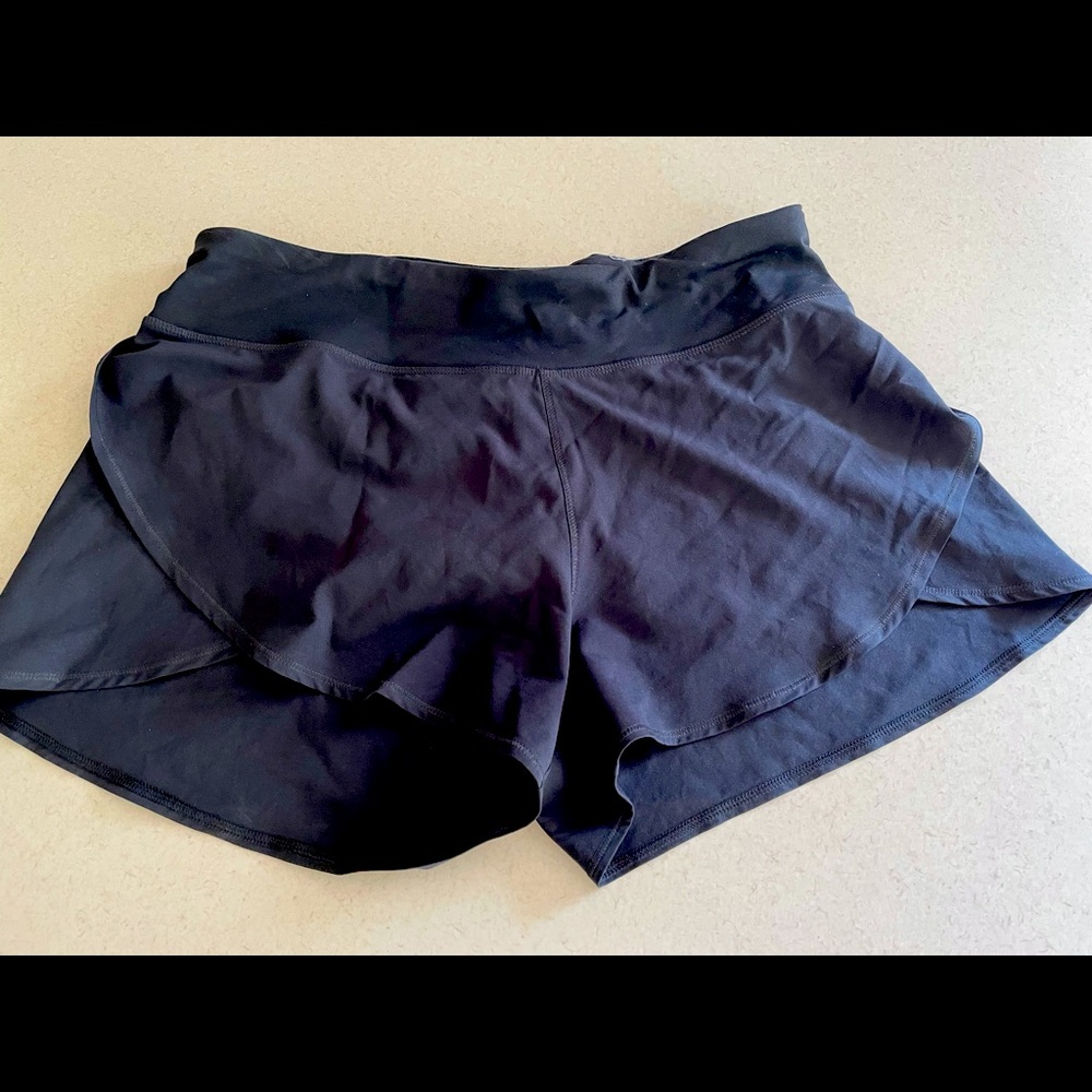 Black flutter shorts by Calia